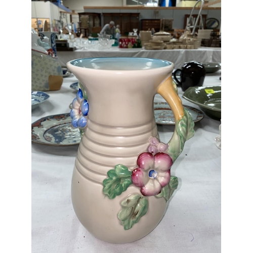464 - A Clarice Cliff ribbed baluster vase with relief floral handle, height 22cm (2cm firing crack to rim... 
