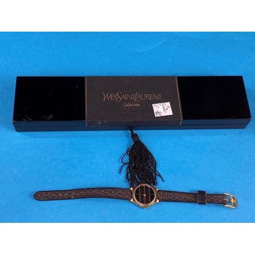 542 - An originally cased lady's Yves Saint Laurent Collection wristwatch on original woven strap, gilt ca... 