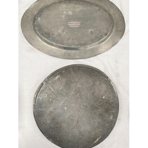 448B - Two 20th century Chinese pewter trays - circular one with dragons, oval with mythical bird, 34cm x 4... 