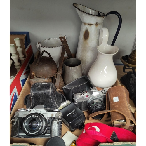 10 - A hand operated sewing machine by Singer; a set of kitchen scales; 3 vintage cameras; cowbells; etc.