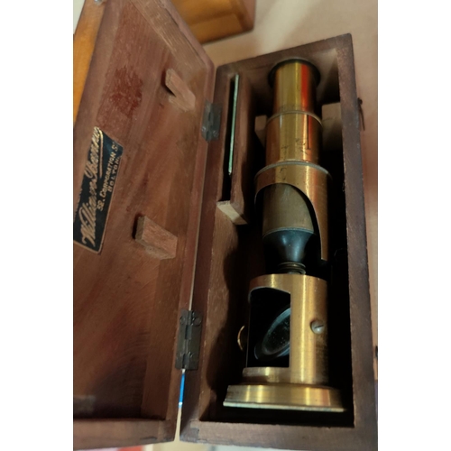 118 - A field/student's brass microscope in mahogany case