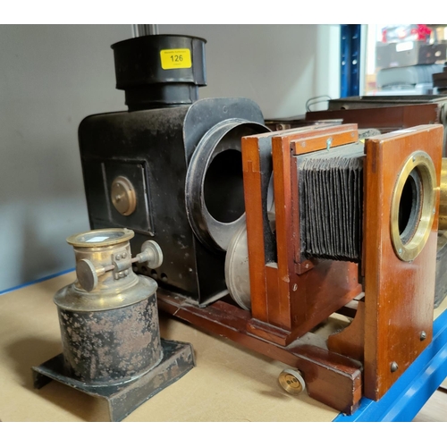 126 - A mahogany, brass and japanned metal magic lantern with lens