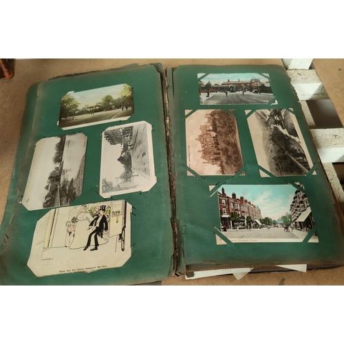 188 - An Edwardian postcard album containing 140+ cards