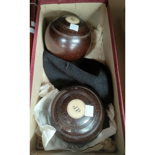 35 - A pair of lignum vitae bowls; 2 walking sticks; decorative items