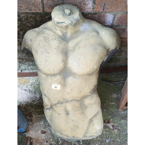 43 - A reconstituted stone part male torso in the classical manner (restoration)