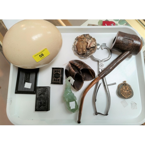 58 - An ostrich egg; 19th century steel sugar nips; other collectables