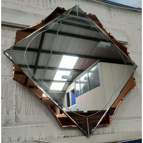626 - A large diamond shaped Art Deco mirror with 4 peach coloured sections, 83cm point to point