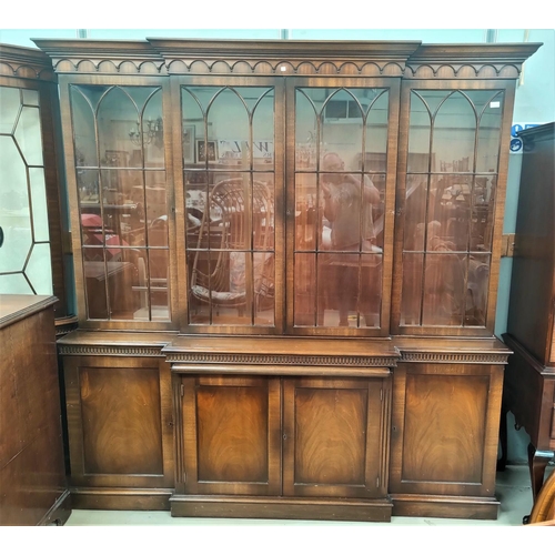 640 - A Georgian style mahogany break front library bookcase in the manner of 