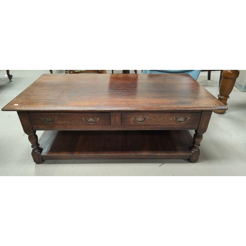 644 - A large oak coffee table with 2 drawers, panelled under shelf, by Arighi Bianci, length 130cm x widt... 