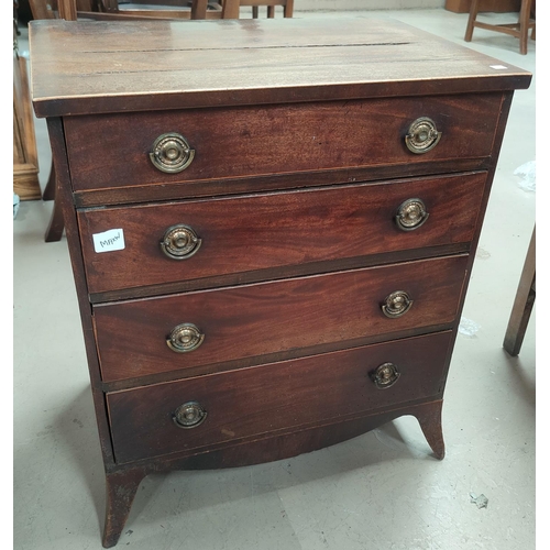661A - A mahogany bachelor's chest of four drawers and satin wood edging (Some areas of splitting top and a... 