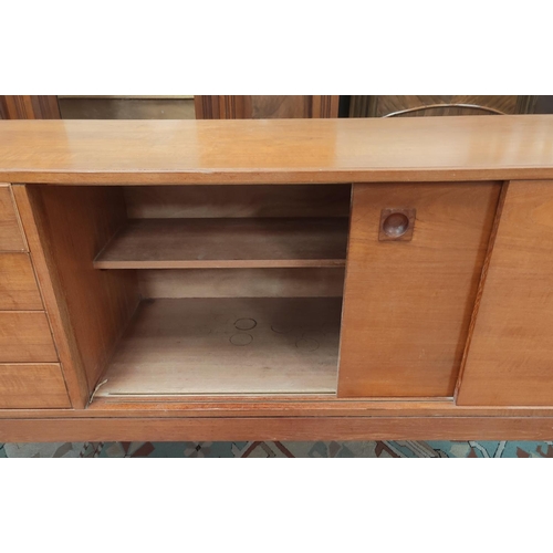 671 - A mid 20th century teak long, low sideboard in the manor of Robert Heritage for Archie Shine with fo... 