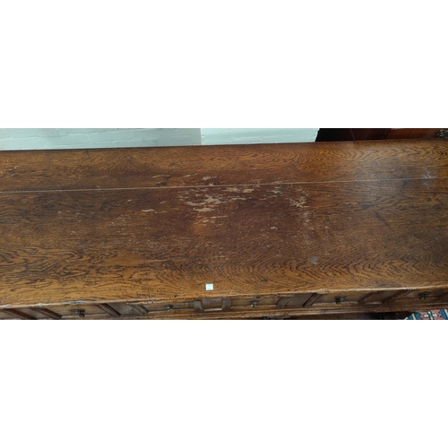 678 - An Oak dresser base with three drawers, turned shelf, under shelf length 172cm depth 51cm height 86c... 