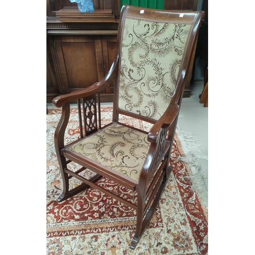 681 - An Edwardian mahogany rocking chair, inlaid stringing decoration
