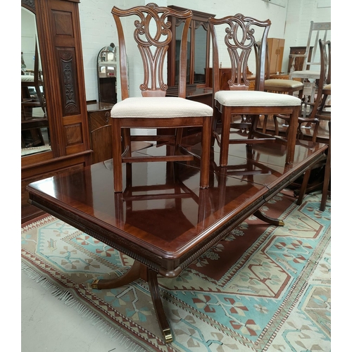 688 - A reproduction extending rectangular dining table with two leaves on twin pedestal and a set of 6 (4... 