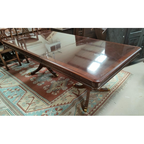 688 - A reproduction extending rectangular dining table with two leaves on twin pedestal and a set of 6 (4... 