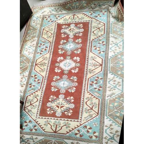 699 - A modern Persian style carpet, hand knotted with geometrical design on a red ground, 360 x 264 cm