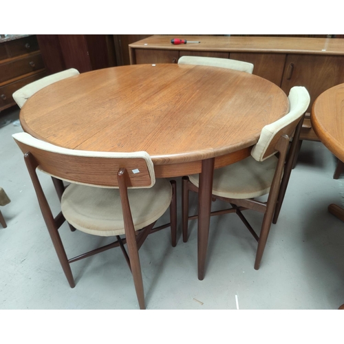 732 - A G-Plan teak dining suite comprising circular table, diameter 120 cm, 6 chairs and sideboard, 146 c... 