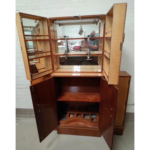 766 - An Art Deco bar in crossbanded birch with open shelves and cupboards to the rear, width 145 cm, and ... 