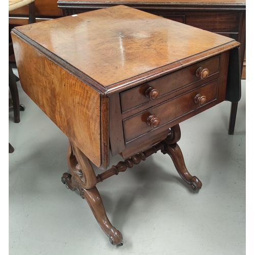 777 - A Victorian walnut Pembroke/work table with two frieze drawers and sliding well on lyre supports, gn... 