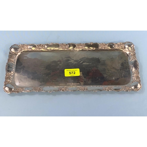 572 - A rectangular planished Swedish white metal tray with floral embossed border, 3 crowns mark inscribe... 