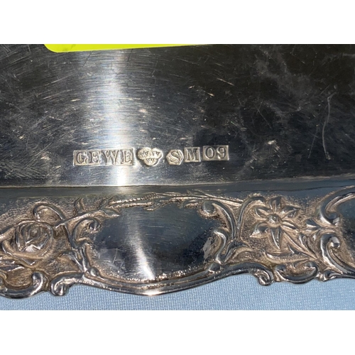 572 - A rectangular planished Swedish white metal tray with floral embossed border, 3 crowns mark inscribe... 