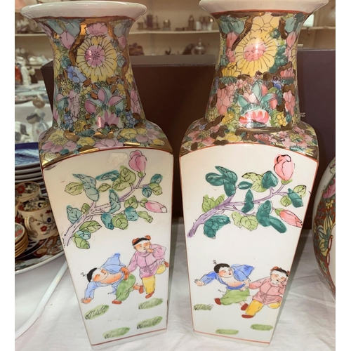 377 - A Chinese pair of porcelain vases of tapering form, square section, decorated in colour enamels; 32 ... 