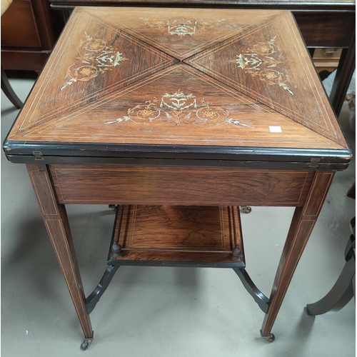 682 - A Victorian Rosewood envelope card table with floral inlay to the top with satinwood inlay with late... 