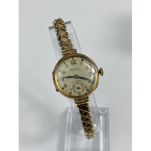 503 - A lady's 9 carat wristwatch with import marks for Glasgow 191, on Excalibur gold plated expanding st... 