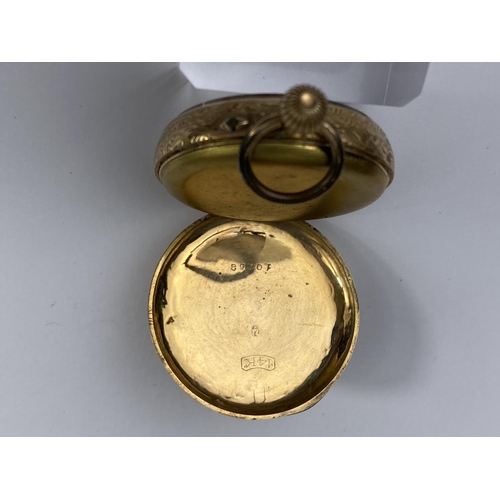 509 - A continental yellow metal fob watch, stamped '14k'