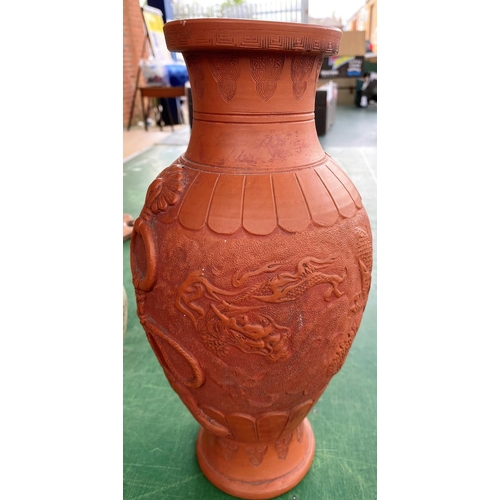 463c - An oriental terracotta vase decorated with dragons, height 30cm and a large Chinese carved wood plat... 