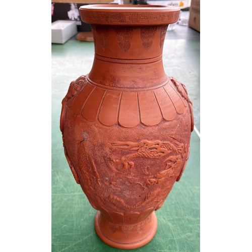 463c - An oriental terracotta vase decorated with dragons, height 30cm and a large Chinese carved wood plat... 