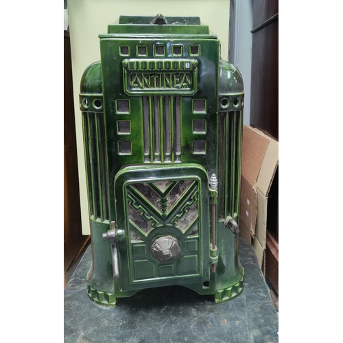 135 - An Art Deco style green enamel ANTINEA log burning stove with single door, ht 62cm, w 35cm, d 25cm