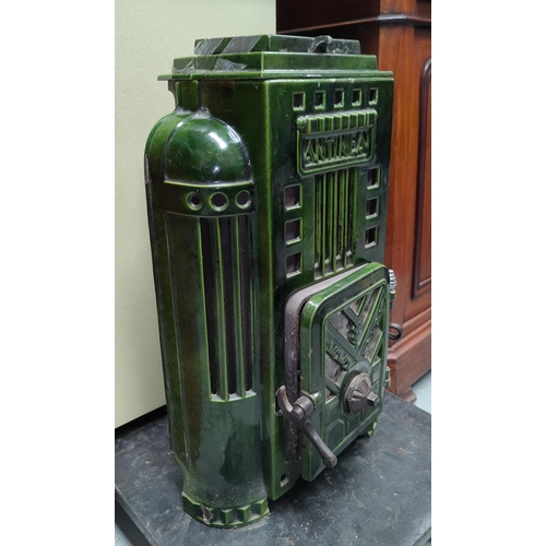 135 - An Art Deco style green enamel ANTINEA log burning stove with single door, ht 62cm, w 35cm, d 25cm