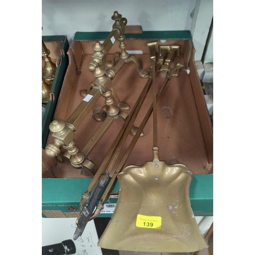 139 - A set of 3 Art Nouveau brass fire irons and a pair of contemporary andirons