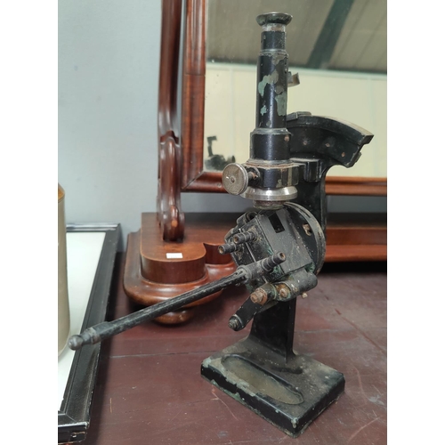 147 - A vintage microscope with side measure