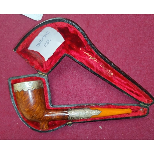 51 - A 19th century briar pipe with silver mounts (dated 1883) and amber mouthpiece, cased