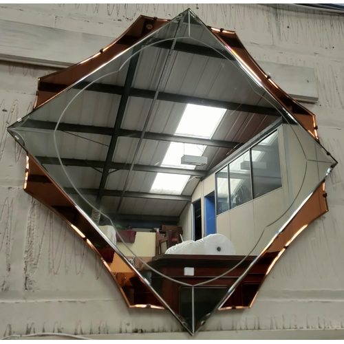 626 - A large diamond shaped Art Deco mirror with 4 peach coloured sections, 83cm point to point