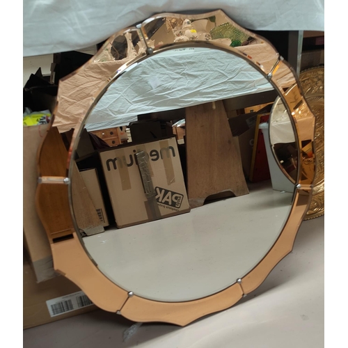 632 - An Art Deco circular peach framed wall mirror