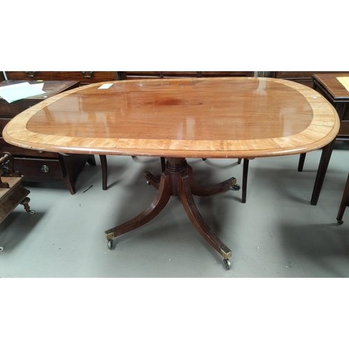 645 - A late 19 / early 20th century Regency style tilt top supper table with wide satin banding, the base... 