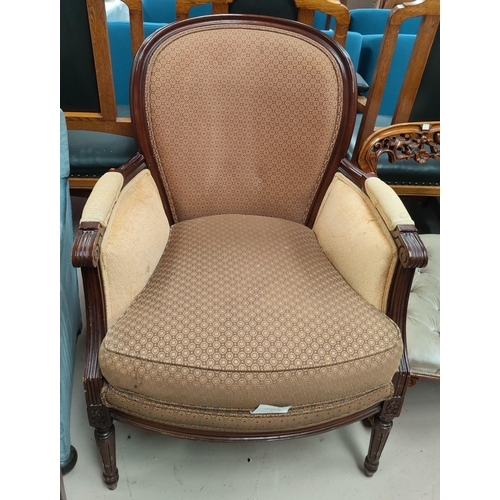 666 - A 'Wesley Hall' armchair in gold upholstery and two other chairs