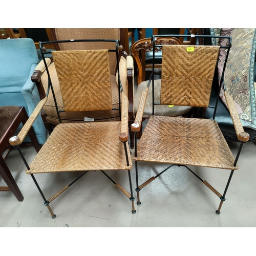 709 - A pair of conservatory armchairs in painted metal and raffia