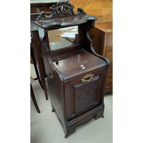 739 - An Edwardian carved mahogany coal box, with fall front, mirror and shelf over