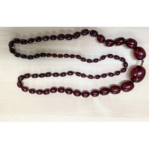 500D - A cherry Bakelite amber coloured graduating bead necklace, largest bead approx 26mm, , length 80cm, ... 
