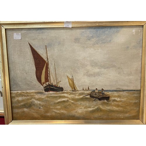 611 - An early 20th century oil painting of fishing boats; a selection of other pictures and prints