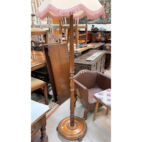 734 - A mahogany period style standard lamp