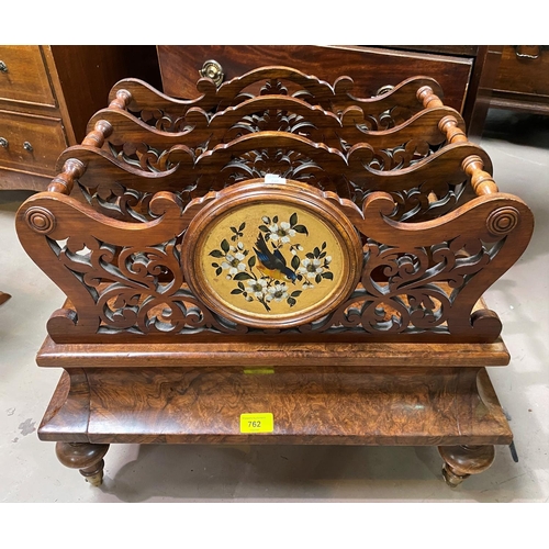 762 - A Victorian figured walnut Canterbury of 3 divisions in fretwork with painted gilded panels and base... 
