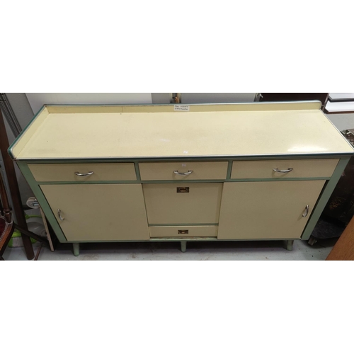 635 - A 1950's Formica kitchen base unit in yellow with 3 frieze drawers, 2 side cupboards and central fal... 