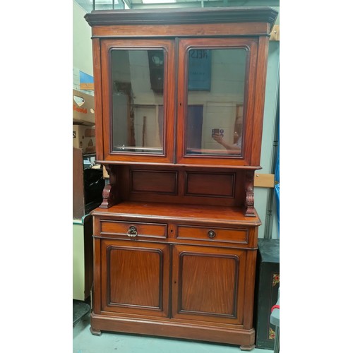 776A - A large Victorian Mahogany full height book case, with glazed double cupboard above and cupboards an... 