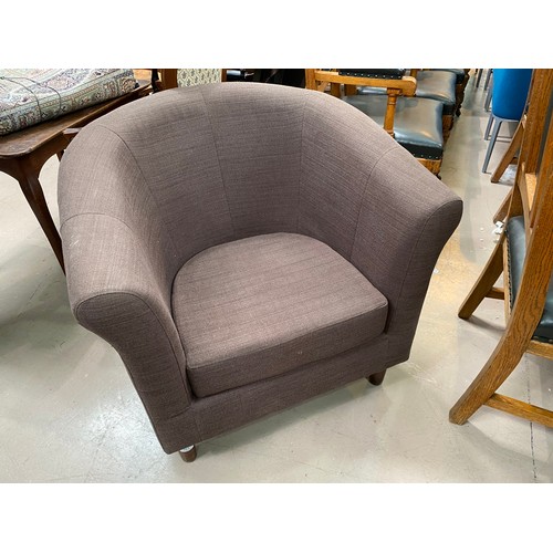 778A - A modern tub shaped armchair in brown woven fabric with John Lewis label