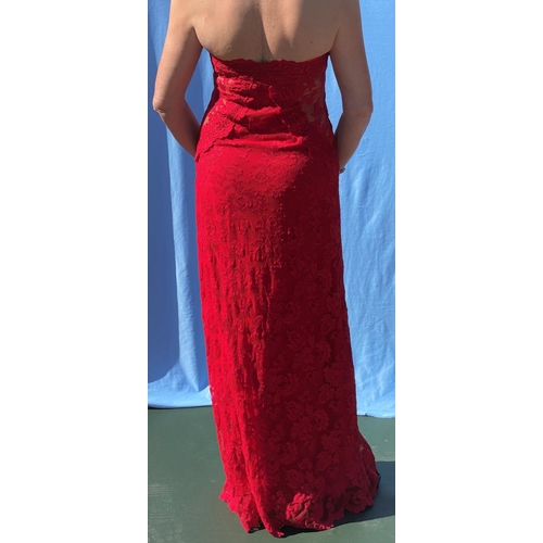 220 - Olvi's The Lace Collection, a red lace halter neck evening dress with sequin details and see through... 